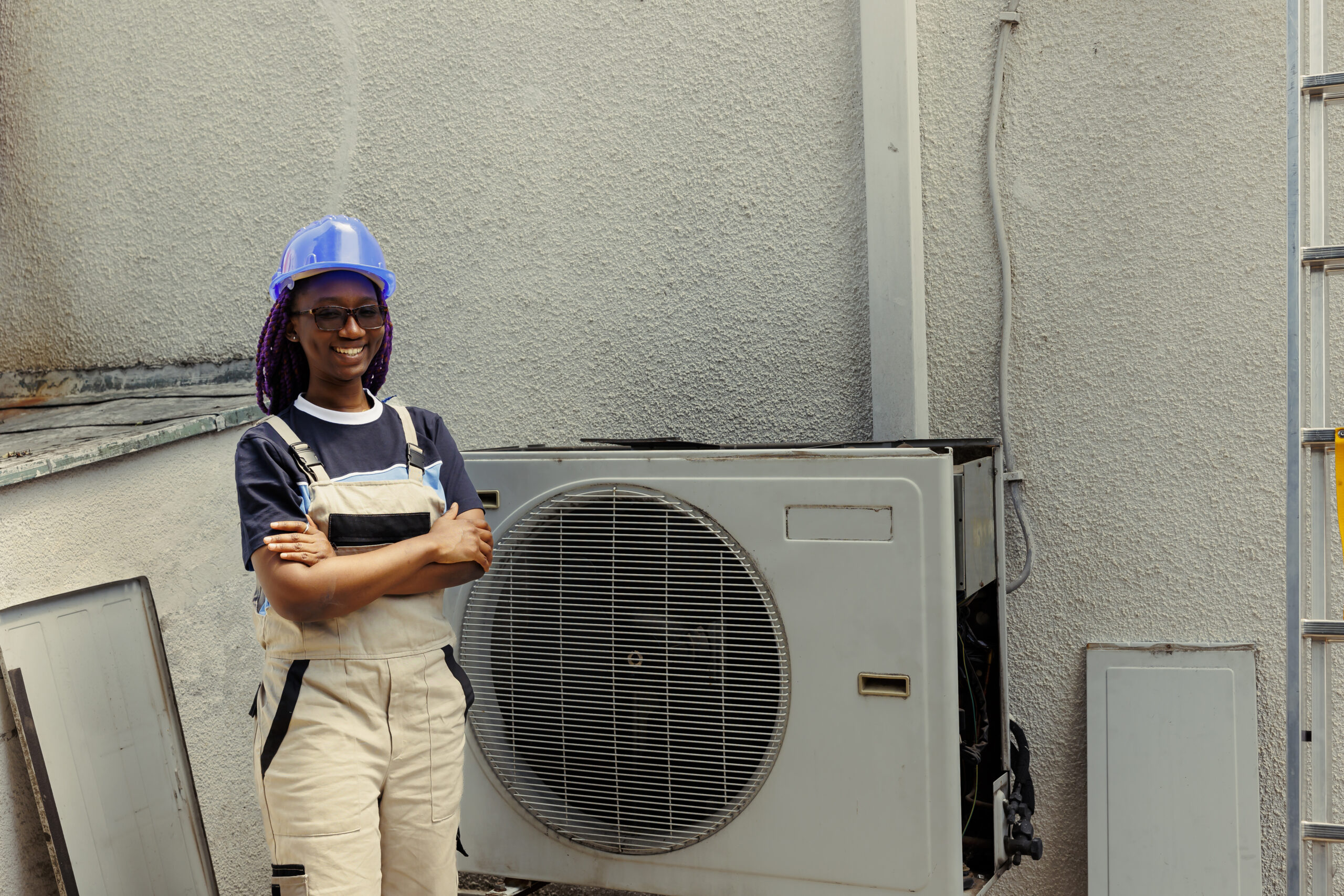 Portrait of cheerful knowledgeable professional proud of work done, standing in front of fixed hvac system. Specialist contracted by client happy with smooth servicing of internal condenser parts